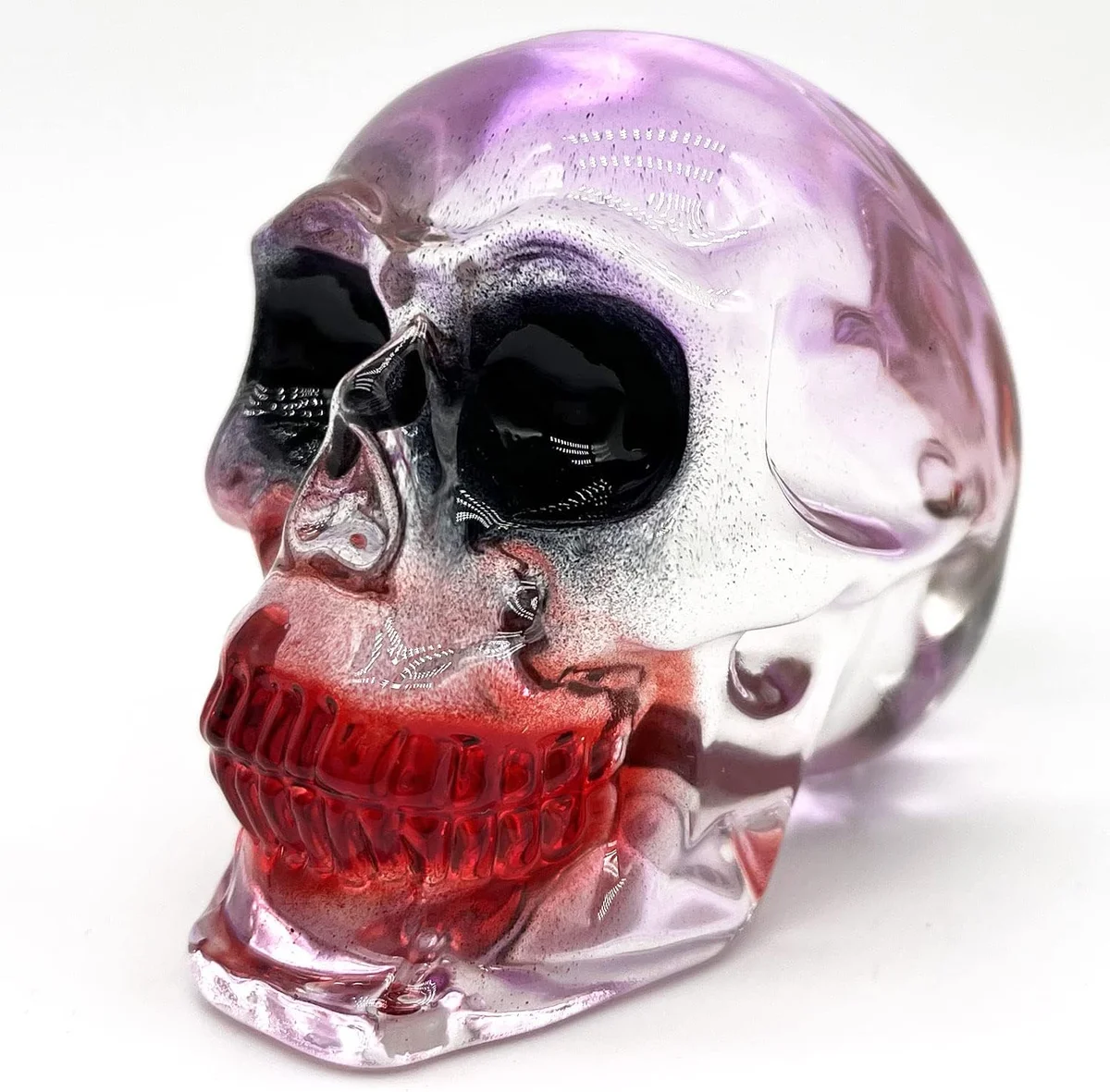 Handcrafted crystal skull head figurine with transparent glass-like appearance