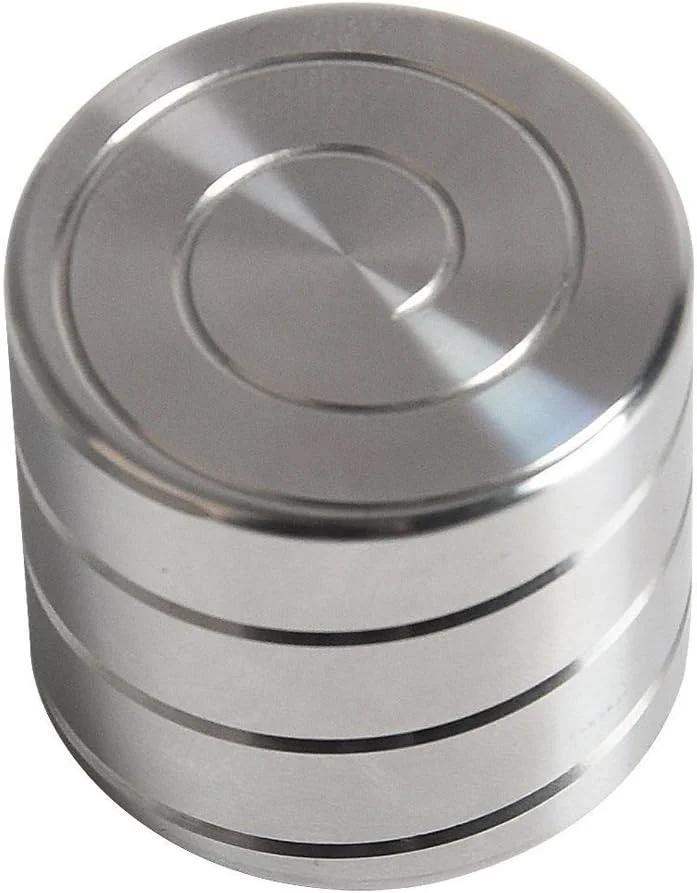 Large kinetic desk toy spinning top with a sculpted vertical helix column, engineered to create a mind-bending optical illusion of continuously flowing motion while spinning silently on a fingertip or desktop