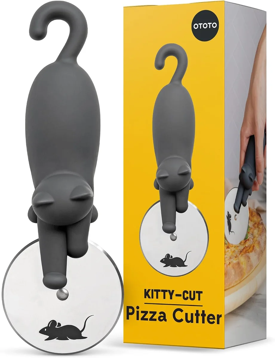 OTOTO Kitty Cut stainless-steel pizza cutter shaped like a cartoon cat gripping a large round cutting wheel, with the cat's body forming the handle above the blade