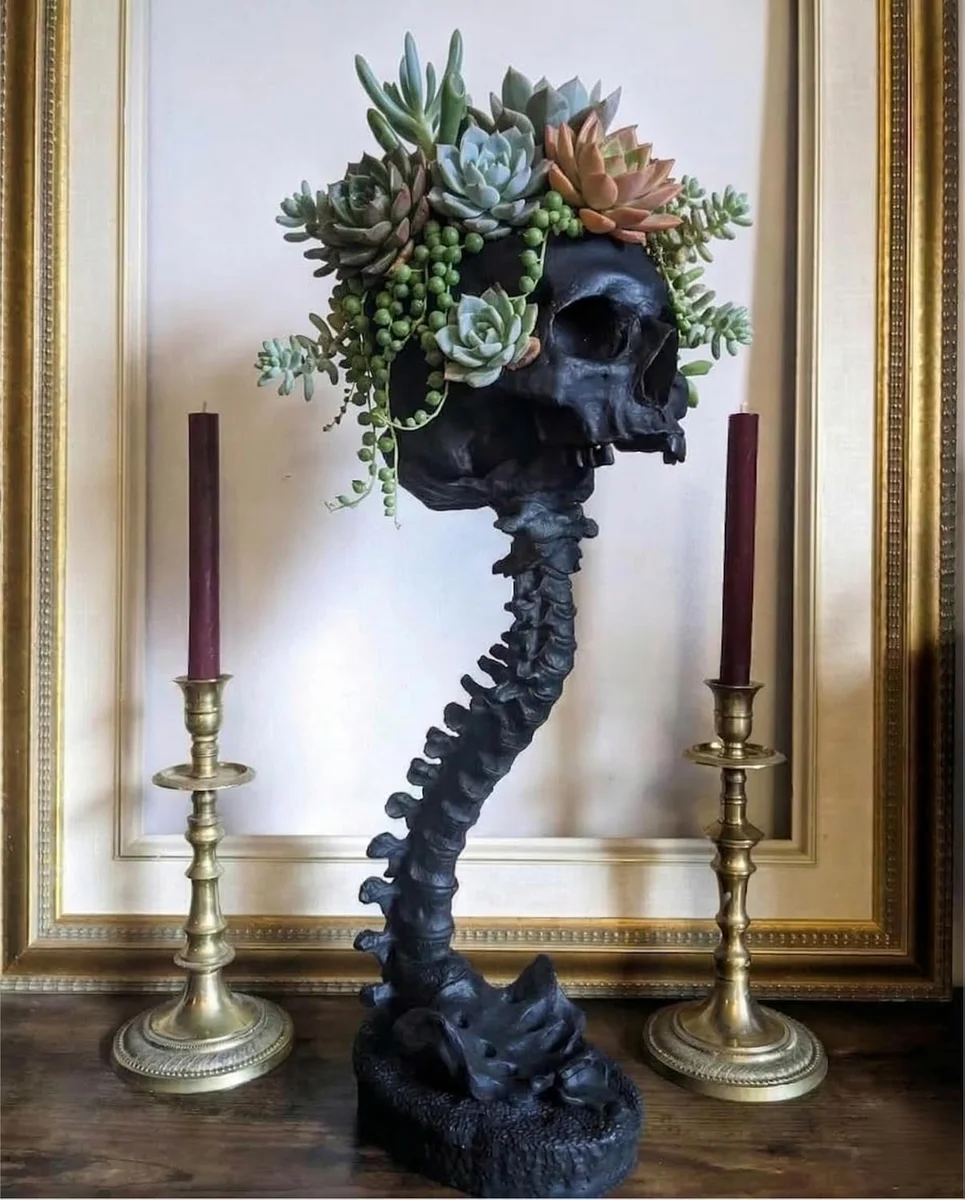Black resin skeleton-shaped air plant planter with gothic styling