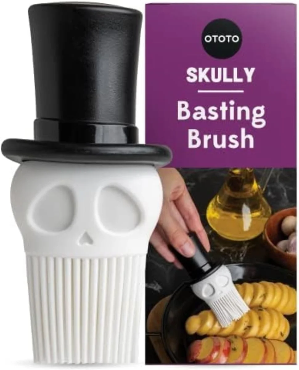 Skull-shaped basting brush with black finish and red silicone bristles